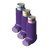 Three purple medical inhalers are lined up side by side. Each inhaler has a different colored band on the top—green, yellow, and red.