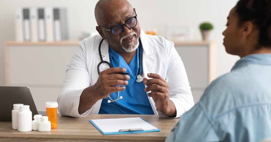 kind doctor having a consultation with his patient