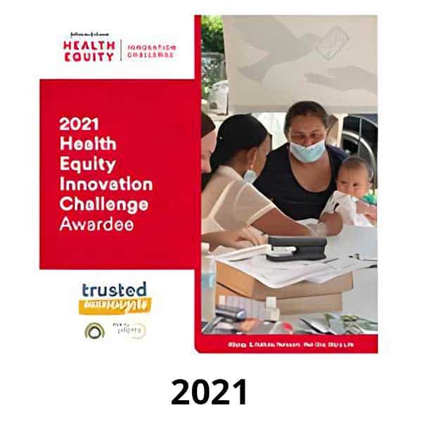 Trusted Messengers 18 A poster titled "2021 Health Equity Innovation Challenge Awardee" features a group of people, including a person holding a baby. The background shows a table with documents and a laptop. Text at the bottom reads "trusted.