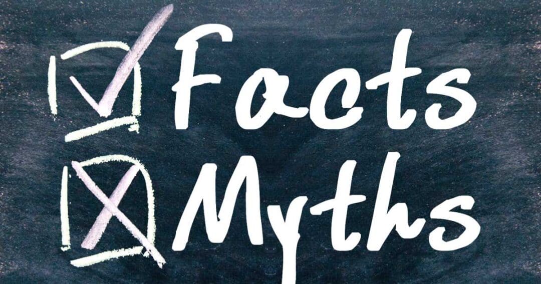 A chalkboard with a checkmark next to the word "Facts" and an X next to the word "Myths," symbolizing the distinction between accuracy and falsehoods.