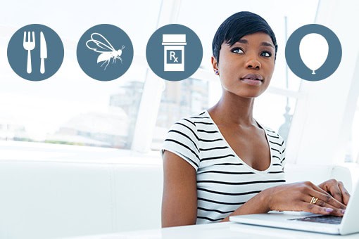 A woman sits at a desk with a laptop, looking thoughtful. Above her are symbols for food, insects, medicine, and a balloon, suggesting considerations or concerns. She wears a striped shirt and is in a bright, modern setting.